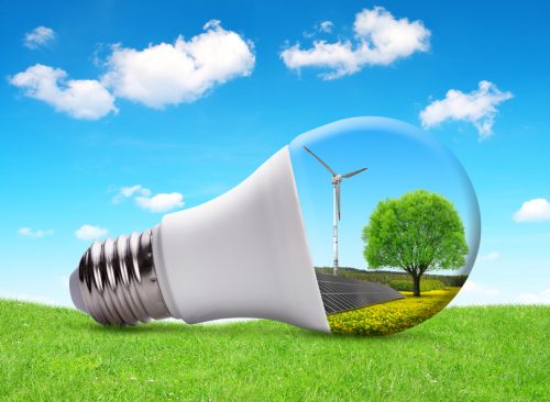Eco LED bulb with solar panel and wind turbine. The concept of sustainable resources.